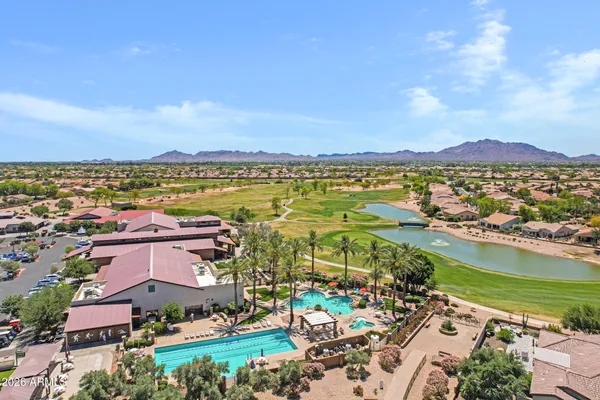 an aerial view of residential building and lake