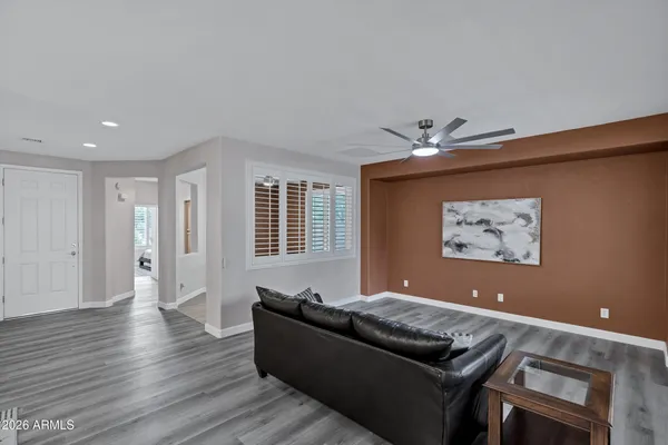 a living room with furniture and a window
