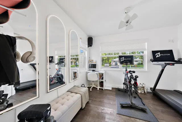 a bedroom with furniture and a flat screen tv