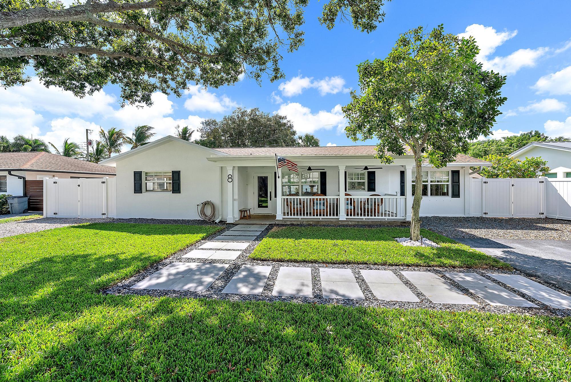 8 Windsor Road West Jupiter, FL 33469 - Photo 3 of 32 a view of a house with a yard