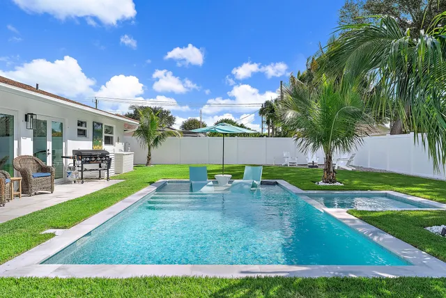 a view of a backyard with a patio