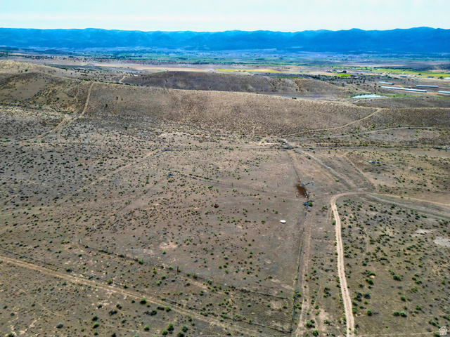 600 East E Street Moroni, UT 84646 - Photo 18 of 38 Expansive, undeveloped parcel featuring varied topography and distant mountainous terrain