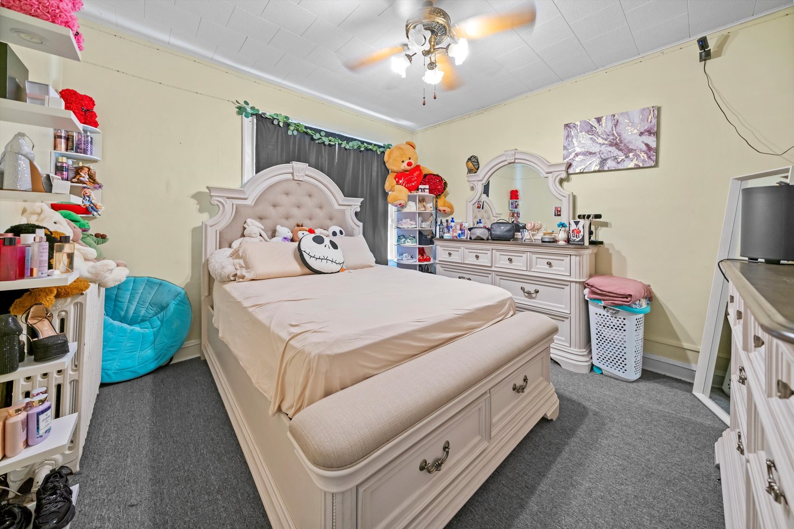 6058 South Massasoit Avenue Chicago, IL 60638 - Photo 25 of 45 a spacious bedroom with a bed a dresser and book shelf