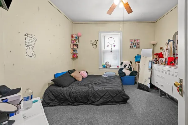 a bed room with a bed and a couch