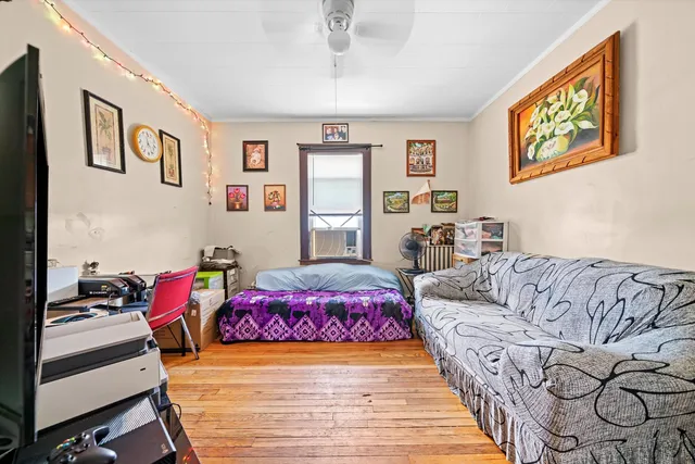 a bedroom with furniture and windows