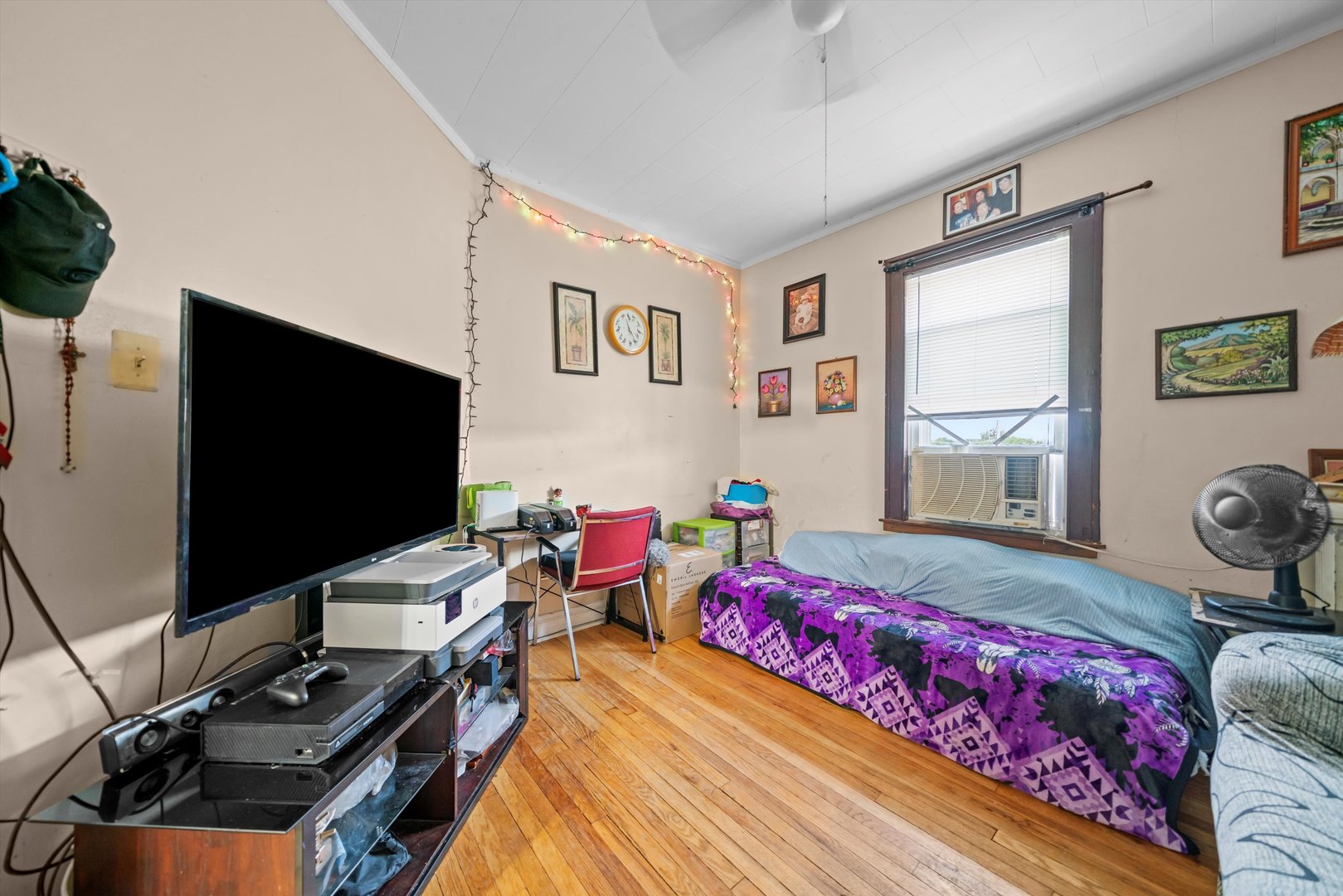 6058 South Massasoit Avenue Chicago, IL 60638 - Photo 36 of 45 a bedroom with bed and a flat screen tv