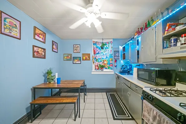 a kitchen with furniture and appliances