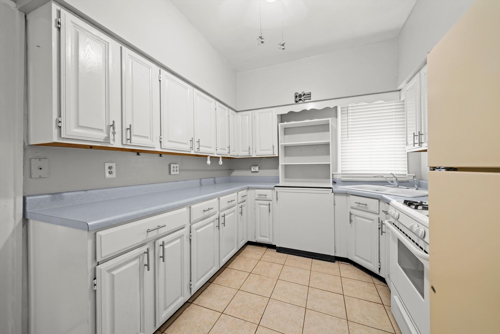 6058 South Massasoit Avenue Chicago, IL 60638 - Photo 10 of 45 a kitchen with granite countertop white cabinets and white appliances