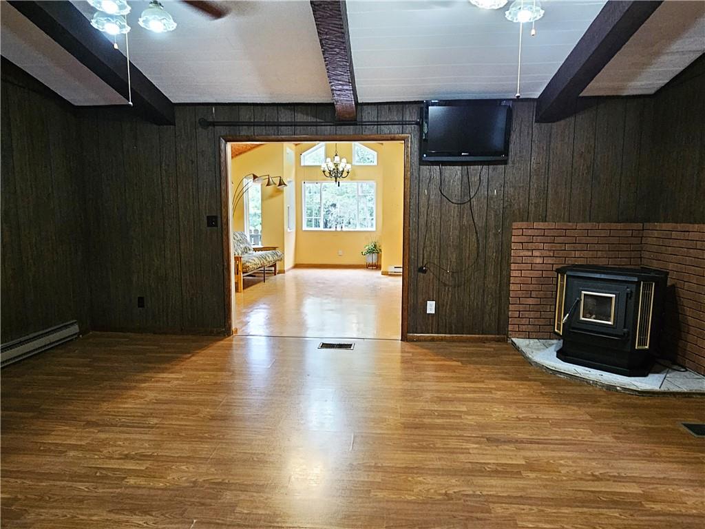 615 Fallen Timbers Road Point Marion, PA 15474 - Photo 13 of 44 a view of an empty room with a fireplace and a window