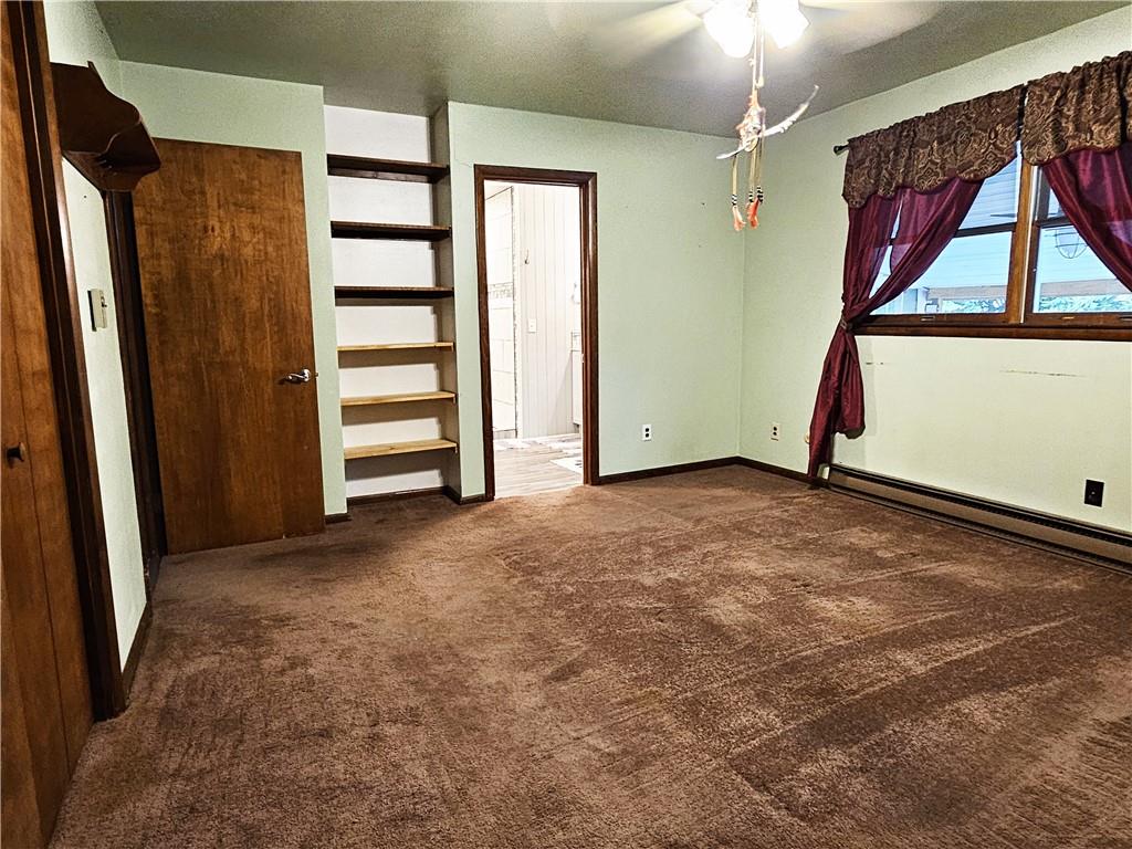 615 Fallen Timbers Road Point Marion, PA 15474 - Photo 20 of 44 an empty room with windows wooden floor and window