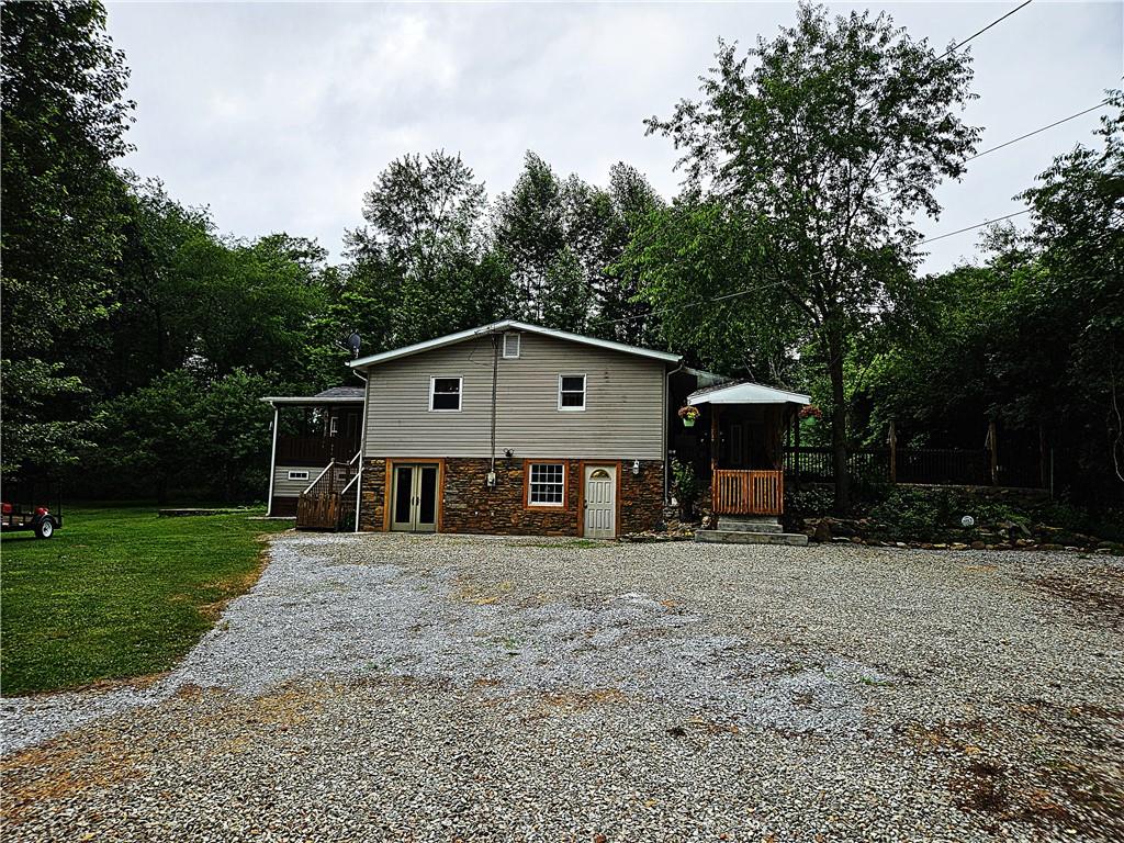615 Fallen Timbers Road Point Marion, PA 15474 - Photo 2 of 44 a front view of a house with a yard
