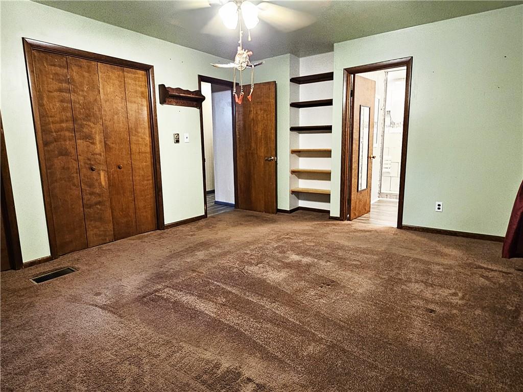 615 Fallen Timbers Road Point Marion, PA 15474 - Photo 21 of 44 an empty room with closet and a ceiling fan
