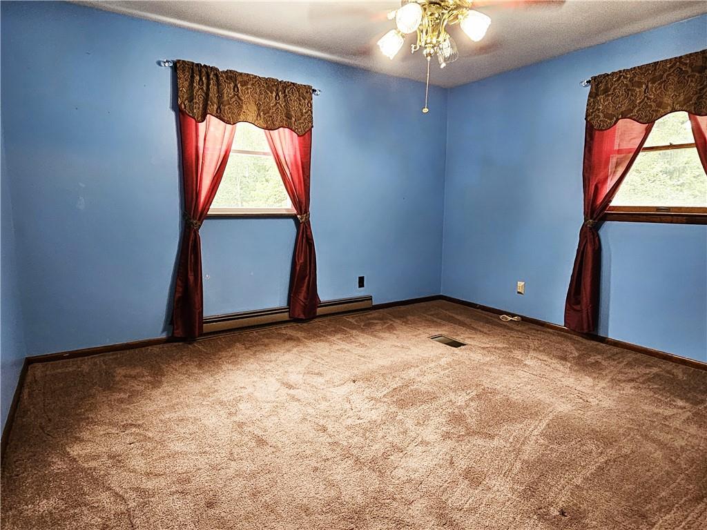 615 Fallen Timbers Road Point Marion, PA 15474 - Photo 25 of 44 an empty room with windows and closet