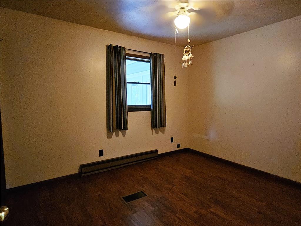 615 Fallen Timbers Road Point Marion, PA 15474 - Photo 27 of 44 an empty room with wooden floor door and fan