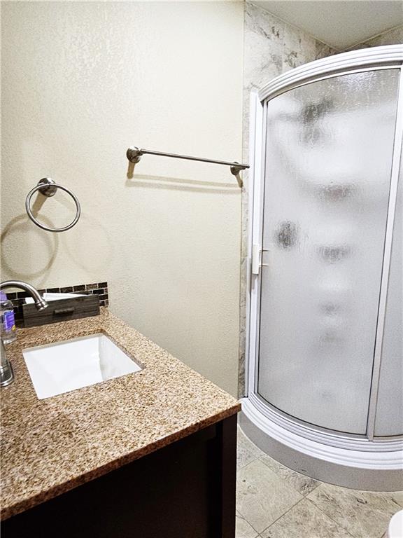 615 Fallen Timbers Road Point Marion, PA 15474 - Photo 29 of 44 a bathroom with a granite countertop sink and a mirror