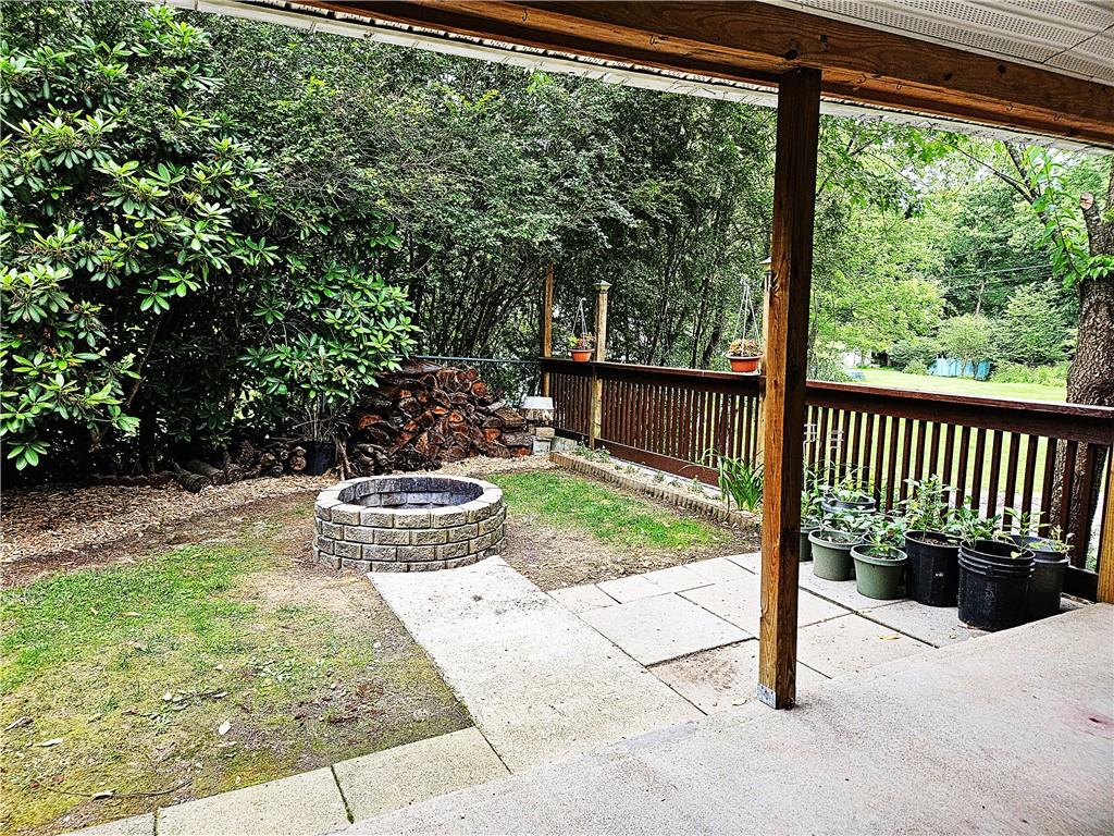 615 Fallen Timbers Road Point Marion, PA 15474 - Photo 37 of 44 a view of a porch with furniture and garden