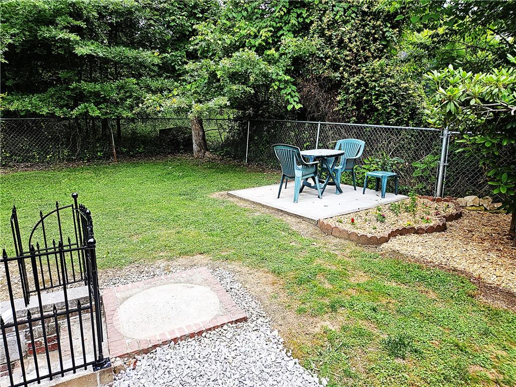 615 Fallen Timbers Road Point Marion, PA 15474 - Photo 38 of 44 a view of a chair and table in backyard