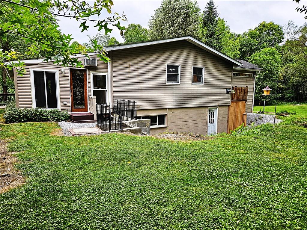 615 Fallen Timbers Road Point Marion, PA 15474 - Photo 40 of 44 a backyard of a house with seating space