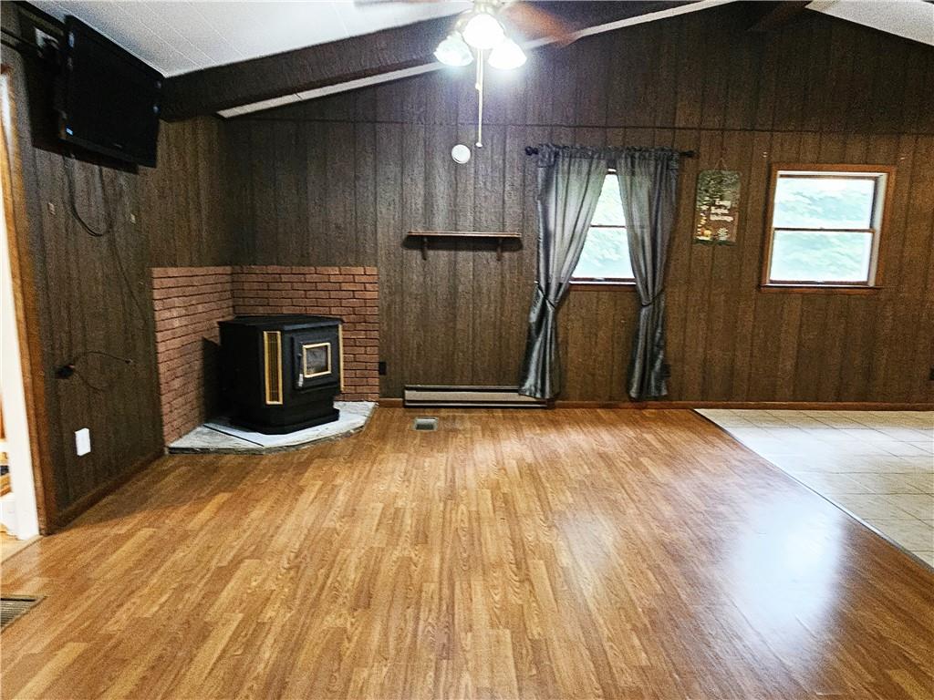 615 Fallen Timbers Road Point Marion, PA 15474 - Photo 9 of 44 a view of empty room with wooden floor and fireplace