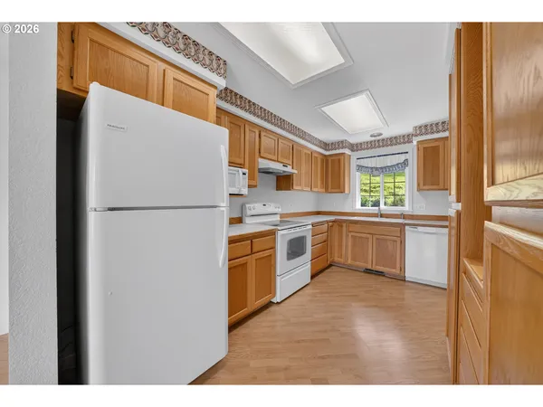 a kitchen with a refrigerator a sink and dishwasher