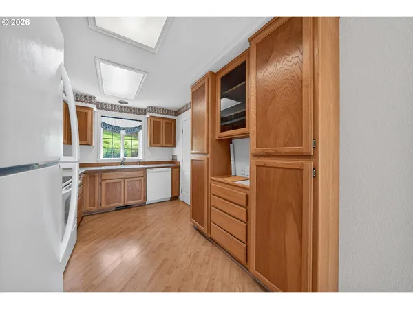 a kitchen with stainless steel appliances a refrigerator and a stove