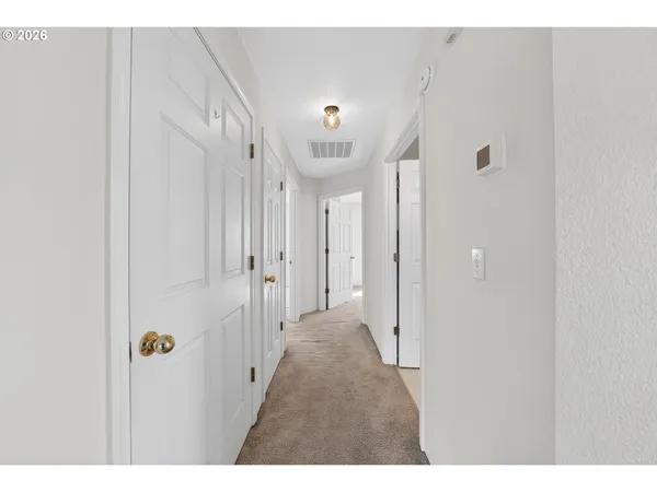 a view of a hallway with closet