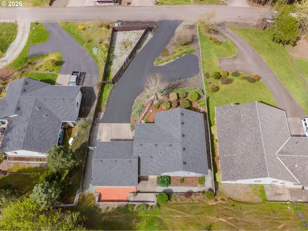 an aerial view of a house with a swimming pool