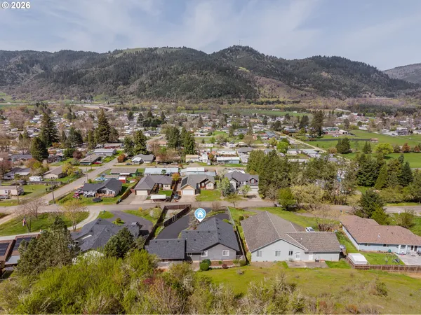 an aerial view of residential houses and outdoor space