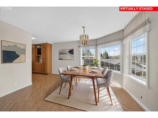 a view of a dining room with furniture window and wooden floor
