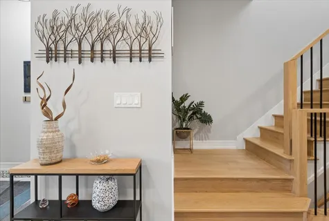 a kitchen with stainless steel appliances kitchen island granite countertop a stove a sink and a microwave