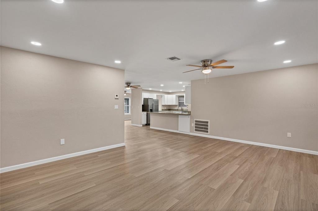 76 Caddy Road Rotonda West, FL 33947 - Photo 17 of 62 a view of a kitchen with a sink and a refrigerator