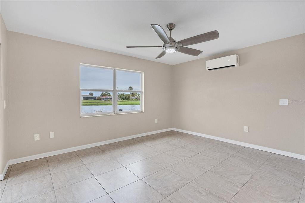 76 Caddy Road Rotonda West, FL 33947 - Photo 30 of 62 a view of an empty room with a window