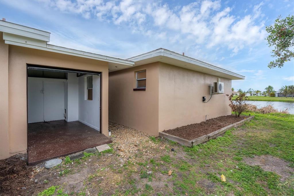 76 Caddy Road Rotonda West, FL 33947 - Photo 39 of 62 a house with yard in front of it