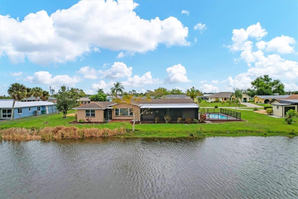 76 Caddy Road Rotonda West, FL 33947 - Photo 51 of 62 a view of residential houses with city view and lake view