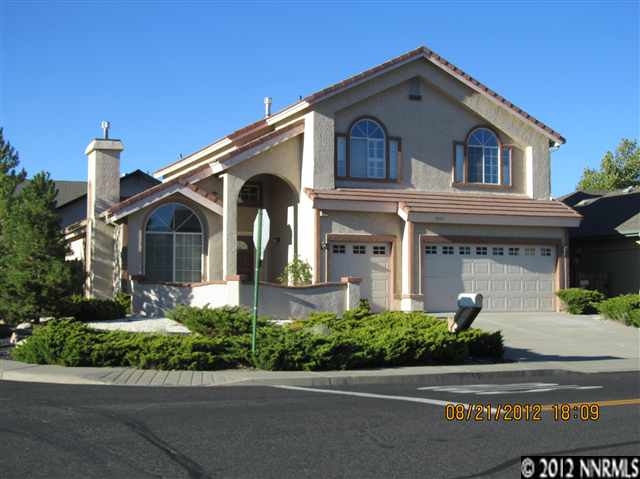 5895 Simons Drive, Unit 1 Reno, NV 89523 - Photo 1 of 1 a front view of a house with a yard and garage