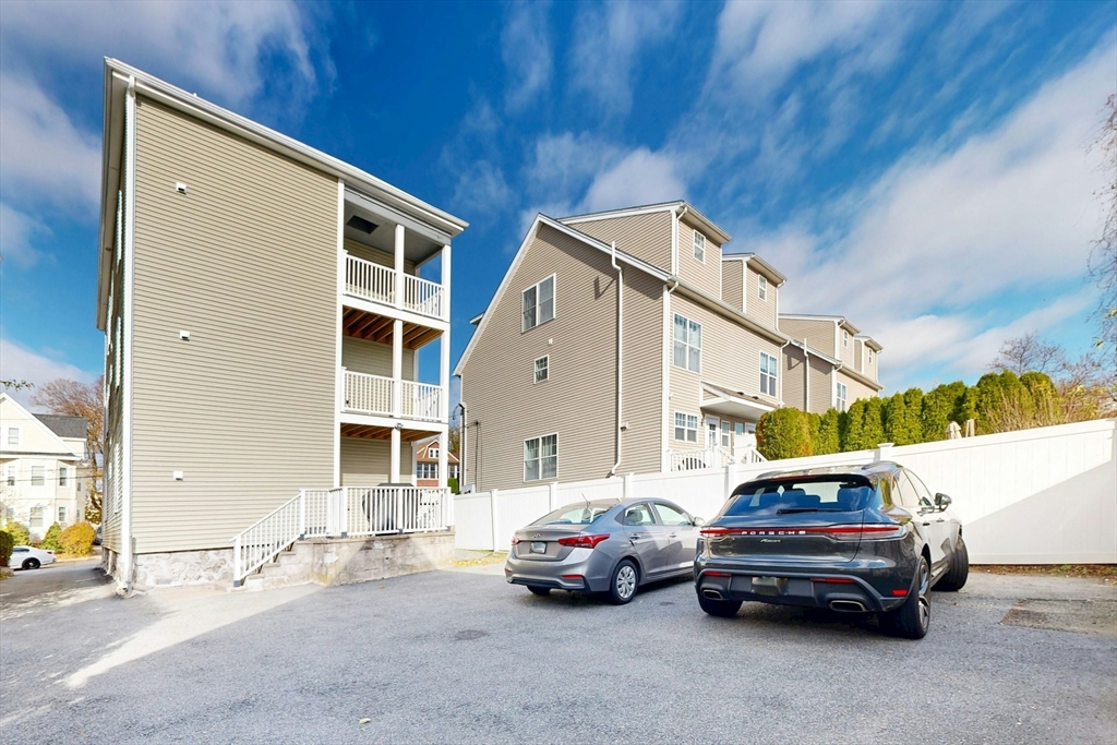 38 Pearl Street, Unit 3 Everett, MA 02149 - Photo 13 of 14 a car parked in front of a house
