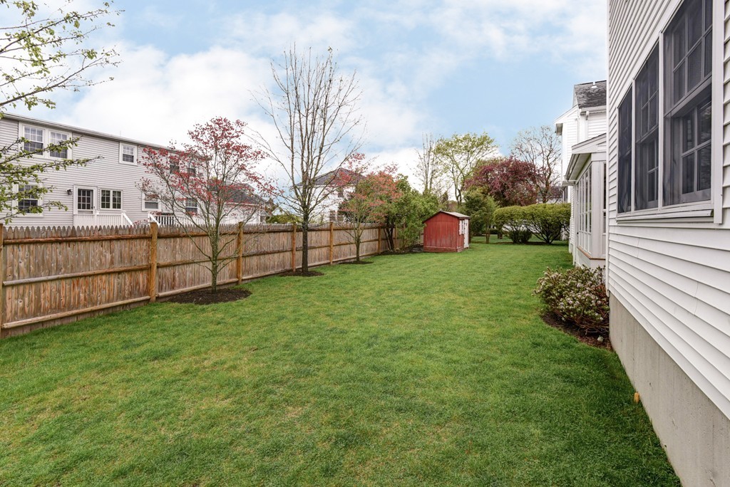 43 Douglas Road Needham, MA 02492 - Photo 23 of 23 a view of a backyard with a garden