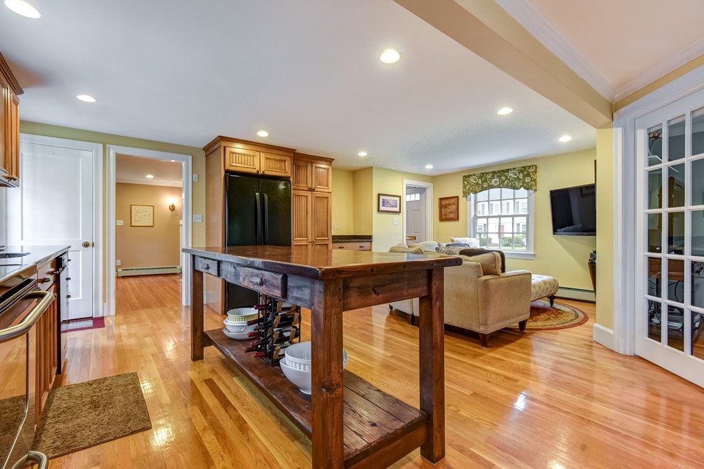 43 Douglas Road Needham, MA 02492 - Photo 3 of 23 a living room with fireplace furniture and a flat screen tv