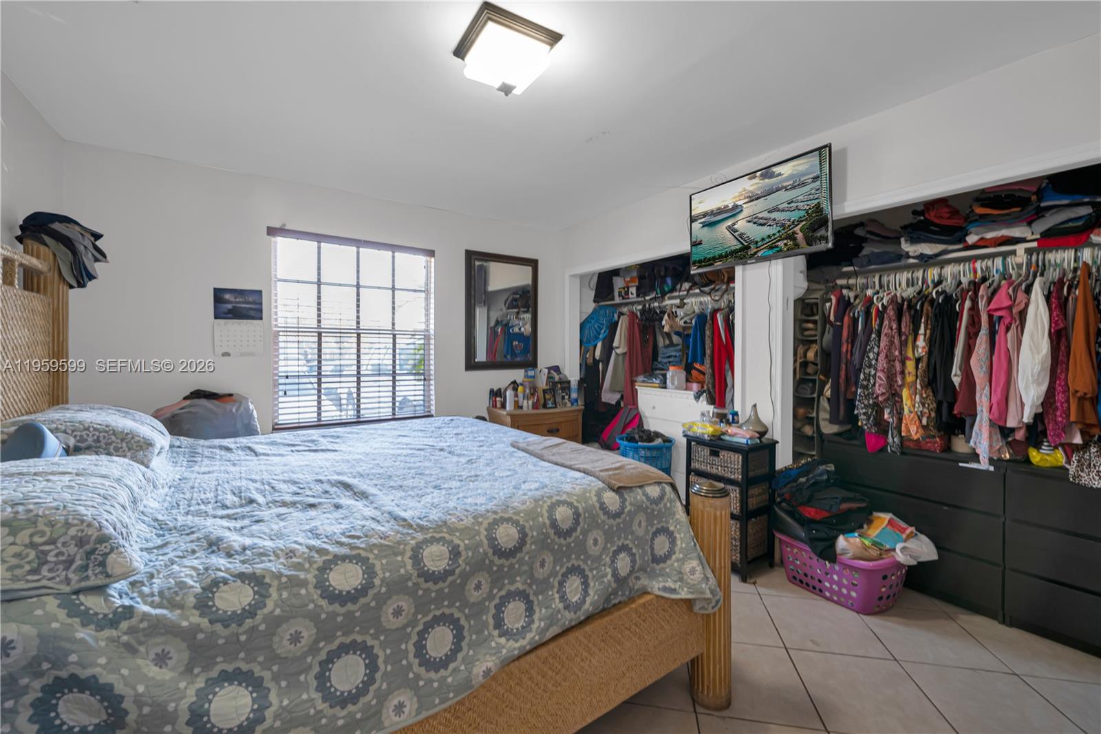 11021 Southwest 4th Street Sweetwater, FL 33174 - Photo 39 of 43 a bed room with a bed and a window