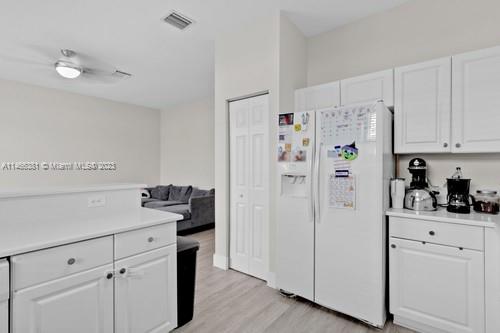 13234 Southwest 128th Path Miami, FL 33186 - Photo 13 of 38 a white refrigerator freezer sitting in a kitchen