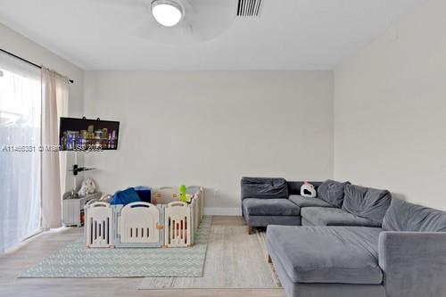 13234 Southwest 128th Path Miami, FL 33186 - Photo 14 of 38 a living room with furniture and a couch