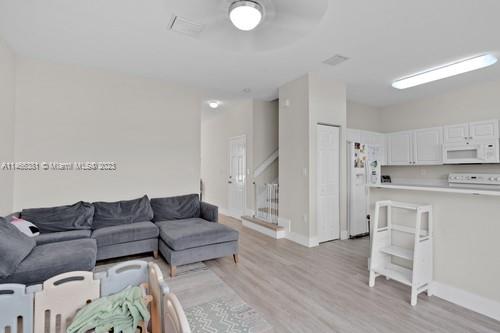 13234 Southwest 128th Path Miami, FL 33186 - Photo 16 of 38 a living room with furniture and a wooden floor