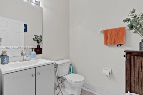 13234 Southwest 128th Path Miami, FL 33186 - Photo 18 of 38 a bathroom with a sink vanity mirror and toilet