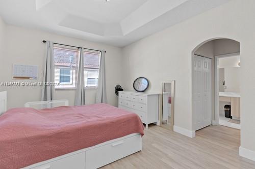 13234 Southwest 128th Path Miami, FL 33186 - Photo 21 of 38 a bedroom with a bed and a window