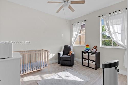 13234 Southwest 128th Path Miami, FL 33186 - Photo 25 of 38 a bedroom with furniture and a window