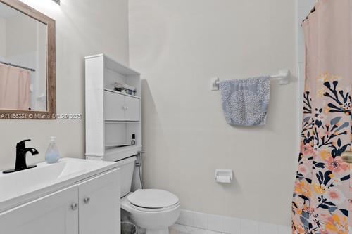 13234 Southwest 128th Path Miami, FL 33186 - Photo 27 of 38 a bathroom with a toilet sink and mirror