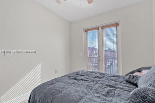 13234 Southwest 128th Path Miami, FL 33186 - Photo 31 of 38 a bedroom with a bed and a window