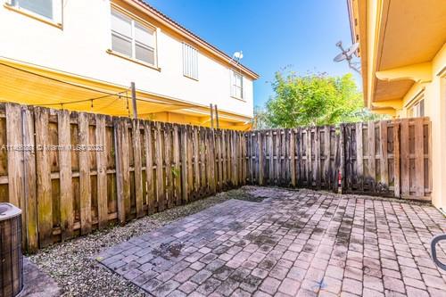 13234 Southwest 128th Path Miami, FL 33186 - Photo 7 of 38 a view of a backyard with wooden fence