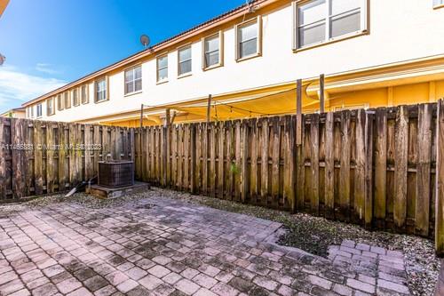 13234 Southwest 128th Path Miami, FL 33186 - Photo 8 of 38 a view of a house with backyard and wooden fence