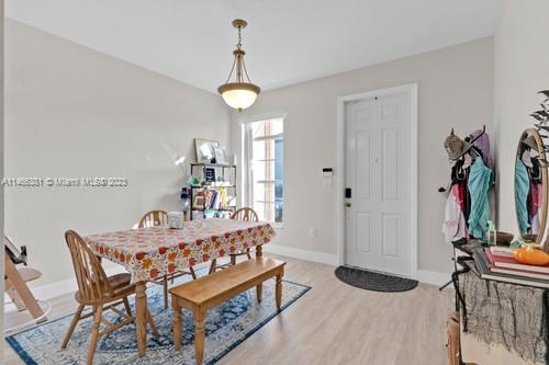 13234 Southwest 128th Path Miami, FL 33186 - Photo 9 of 38 a view of a dining room with furniture and a chandelier